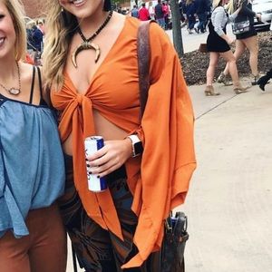 Orange tie top from these three boutique